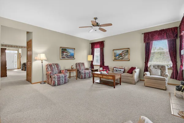 a living room with stainless steel appliances kitchen island granite countertop furniture and a kitchen view