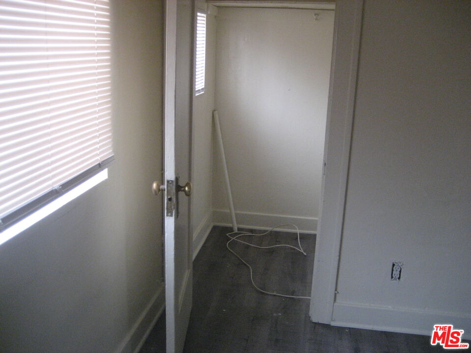 105 West 106th Street, Unit 109 Los Angeles, CA 90003 - Photo 7 of 19 an empty room with a door