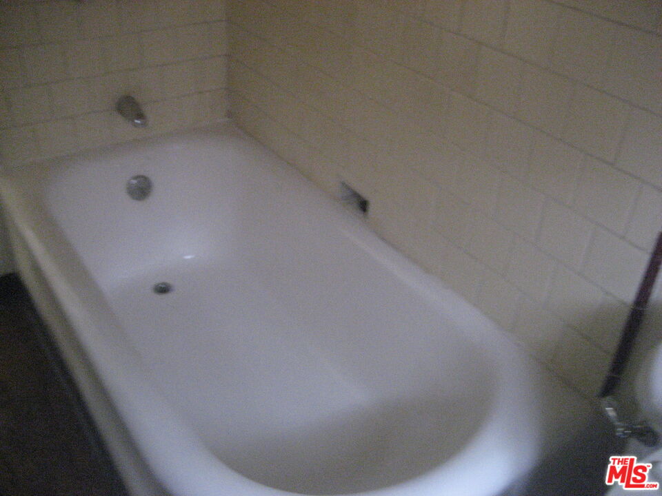105 West 106th Street, Unit 109 Los Angeles, CA 90003 - Photo 9 of 19 a view of a bathtub in a bathroom