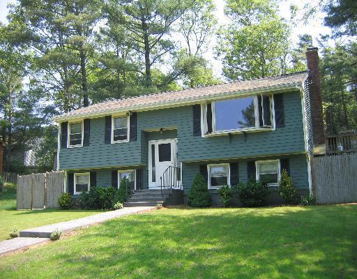 10 Wolf Road Bourne, MA 02532 - Photo 1 of 9 a front view of a house with a garden