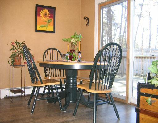 10 Wolf Road Bourne, MA 02532 - Photo 5 of 9 a view of a dining room with furniture window and wooden floor
