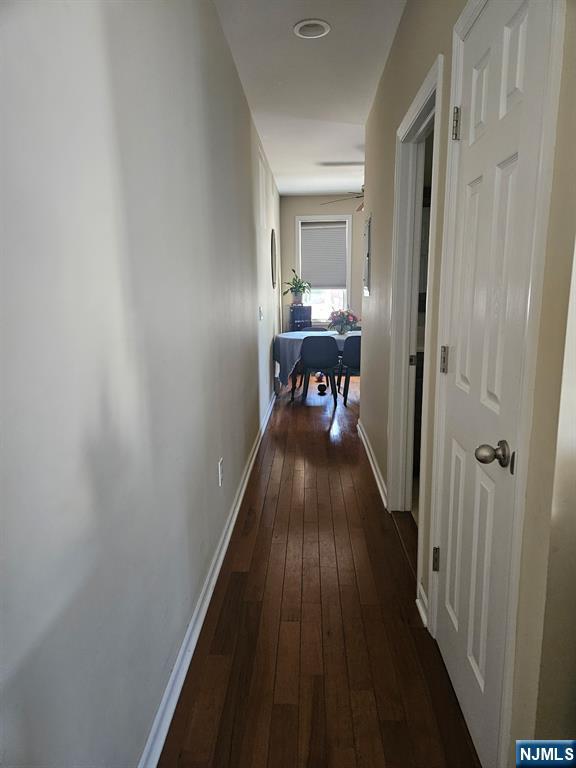 15 William Street, Unit 2 Rochelle Park, NJ 07662 - Photo 9 of 12 a view of a hallway and a livingroom with furniture