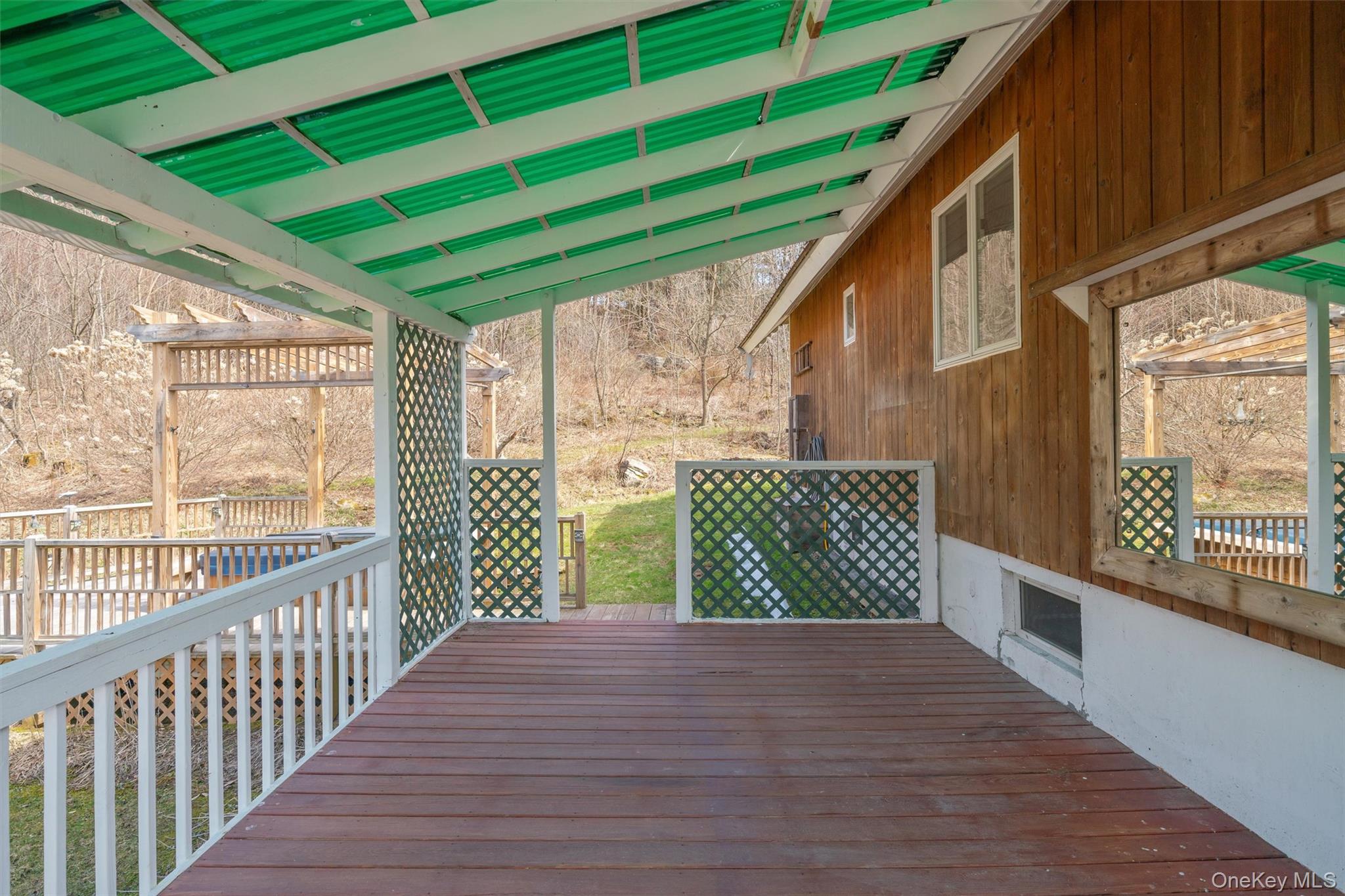 242 Callicoon Center Road Jeffersonville, NY 12748 - Photo 11 of 44 a view of a deck with wooden floor and wooden fence
