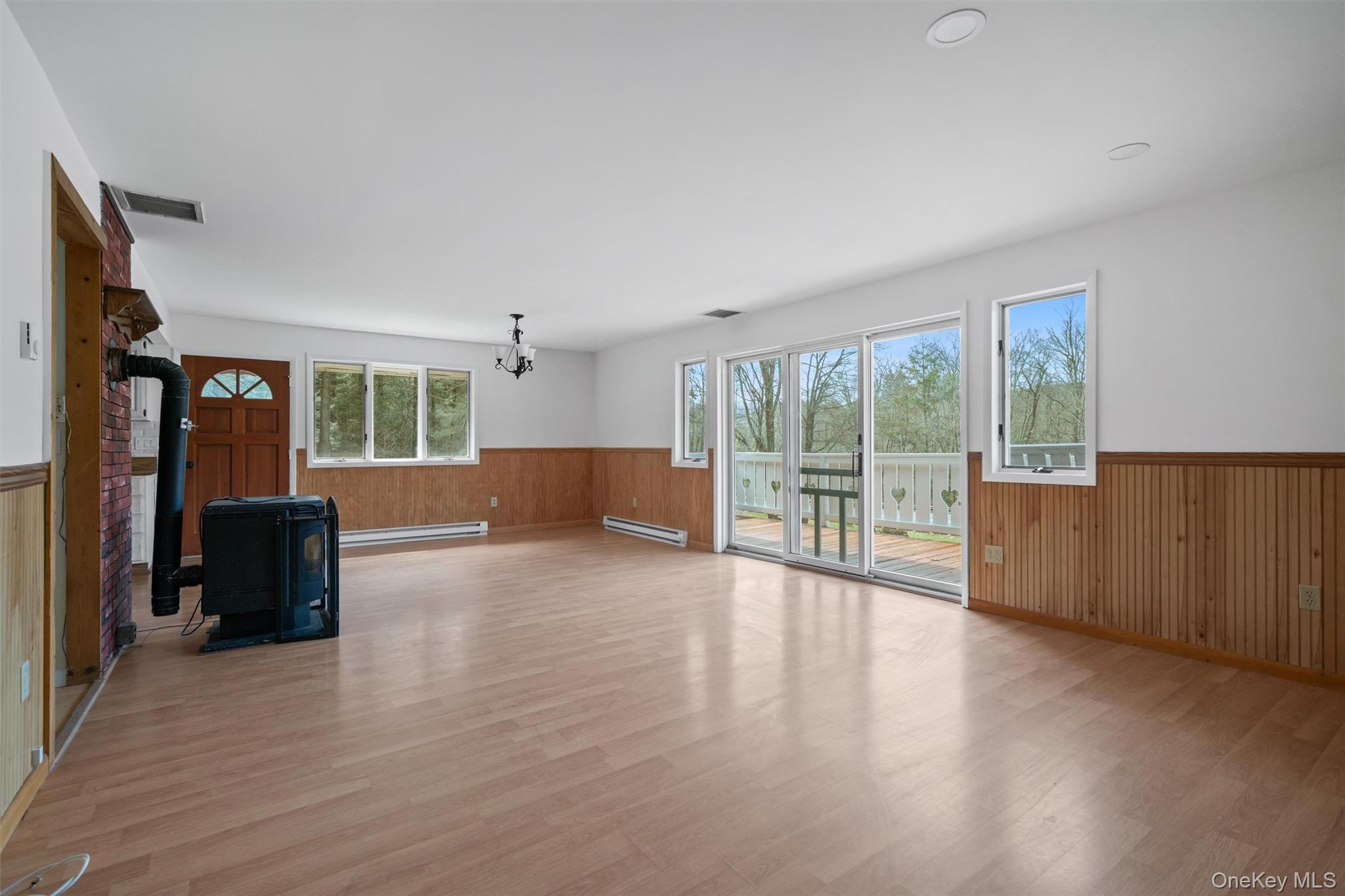242 Callicoon Center Road Jeffersonville, NY 12748 - Photo 15 of 44 a view of an empty room with wooden floor and a window