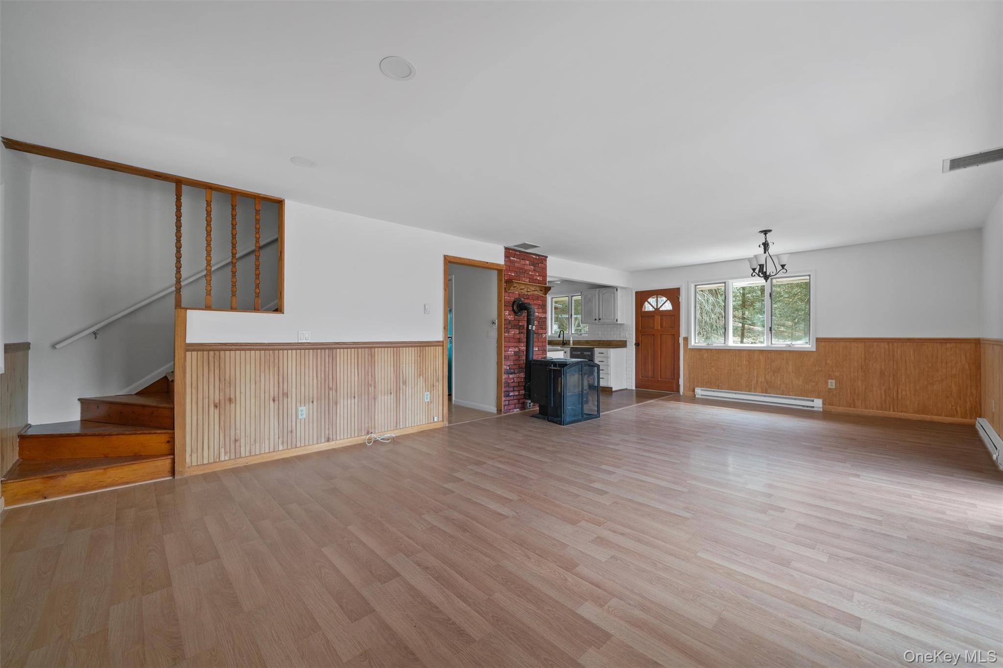 242 Callicoon Center Road Jeffersonville, NY 12748 - Photo 16 of 44 a view of an empty room with a window and wooden floor