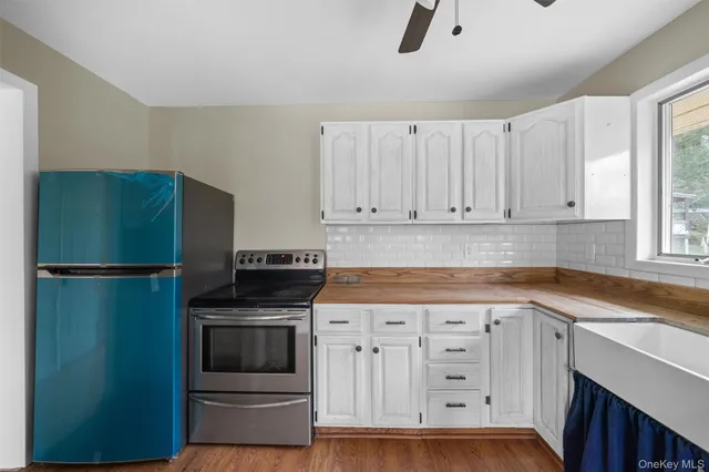 a view of room with wooden floor and window