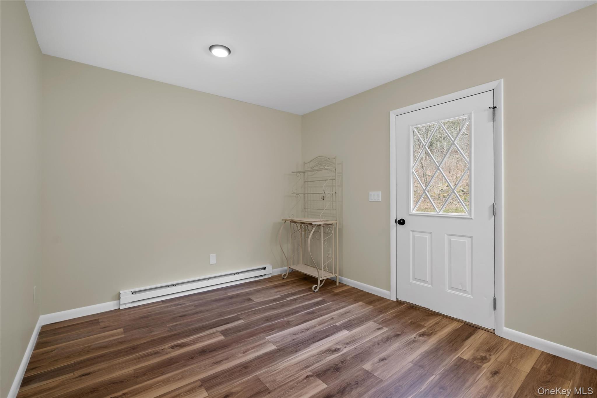 242 Callicoon Center Road Jeffersonville, NY 12748 - Photo 21 of 44 a view of room with wooden floor and window
