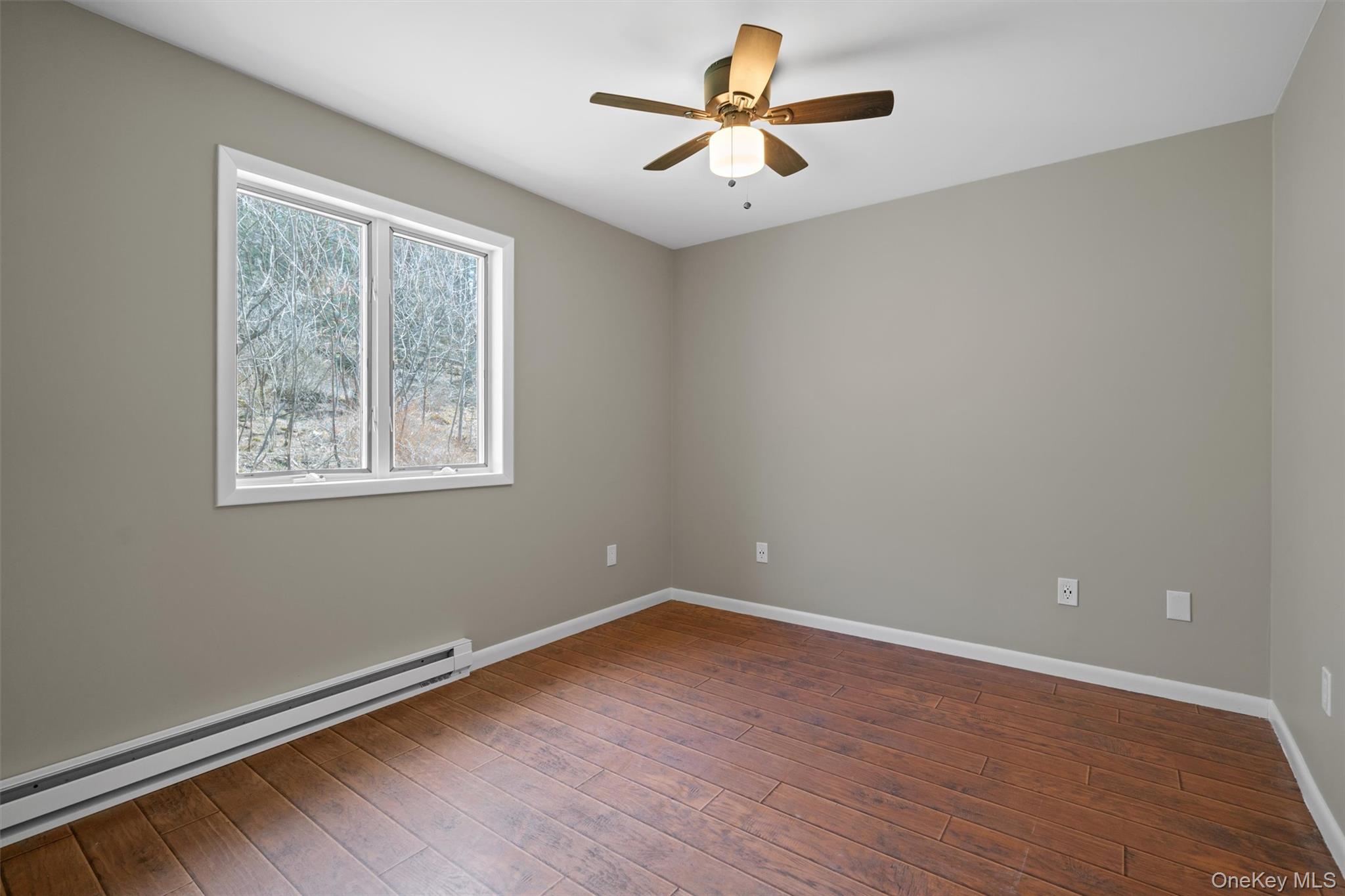 242 Callicoon Center Road Jeffersonville, NY 12748 - Photo 22 of 44 a view of empty room with wooden floor and fan
