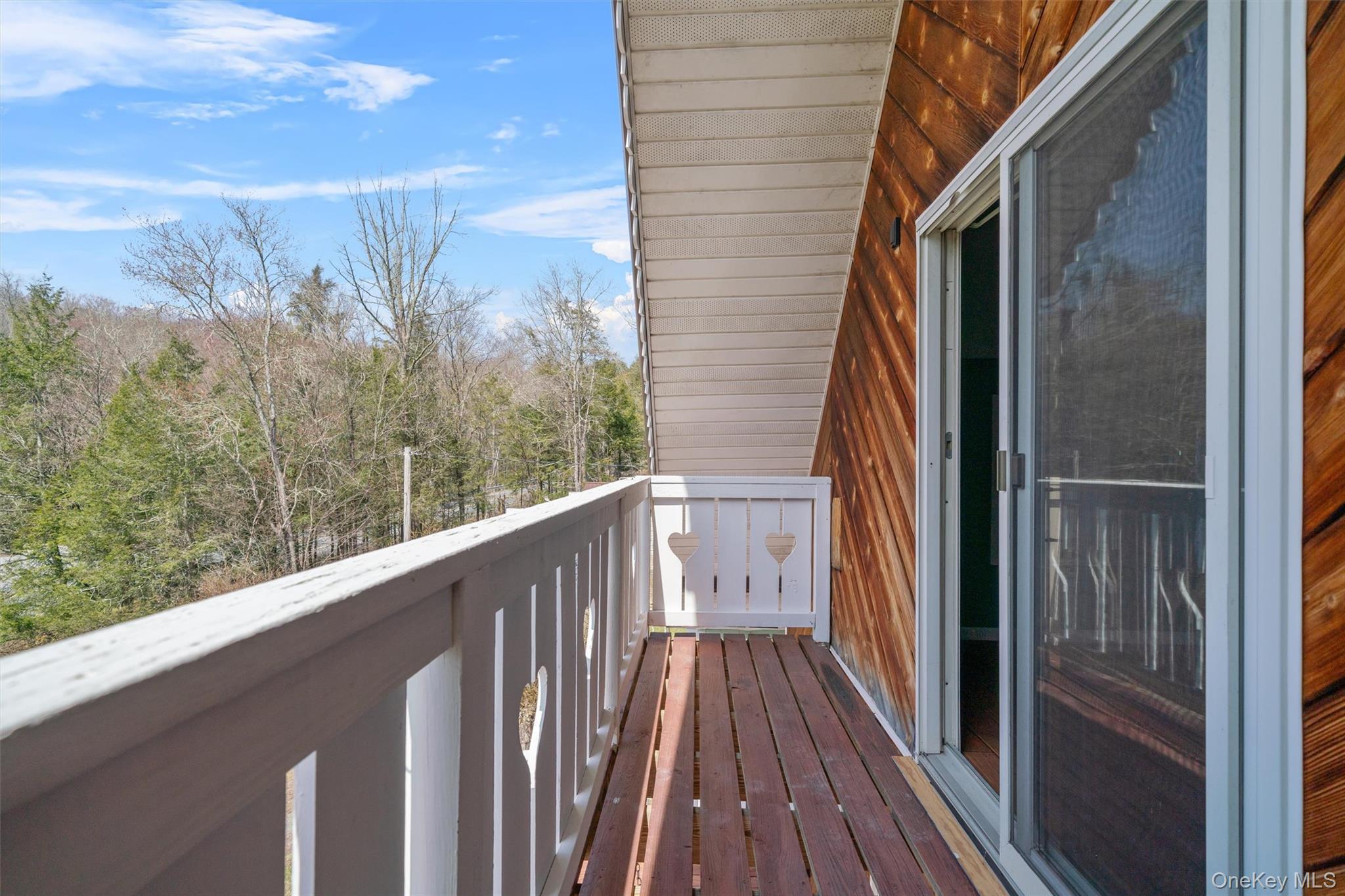 242 Callicoon Center Road Jeffersonville, NY 12748 - Photo 25 of 44 a view of a balcony with wooden floor and fence
