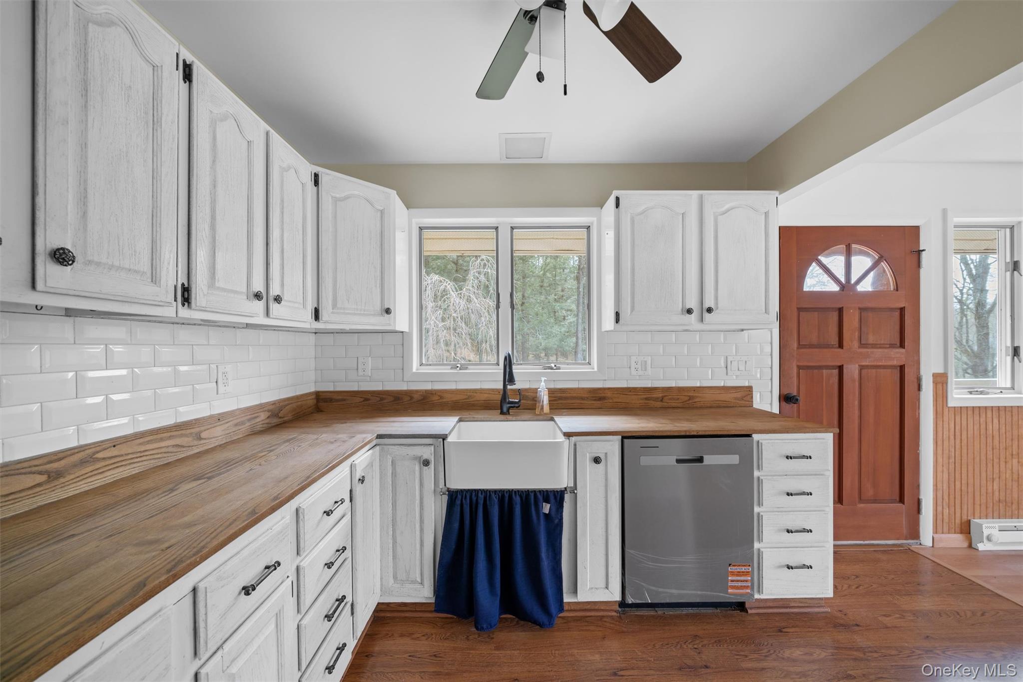 242 Callicoon Center Road Jeffersonville, NY 12748 - Photo 4 of 44 a kitchen with stainless steel appliances granite countertop a sink and cabinets with wooden floor