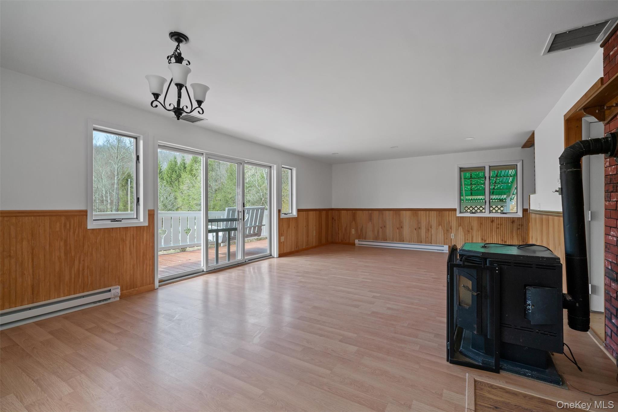 242 Callicoon Center Road Jeffersonville, NY 12748 - Photo 7 of 44 a living room with furniture and large windows