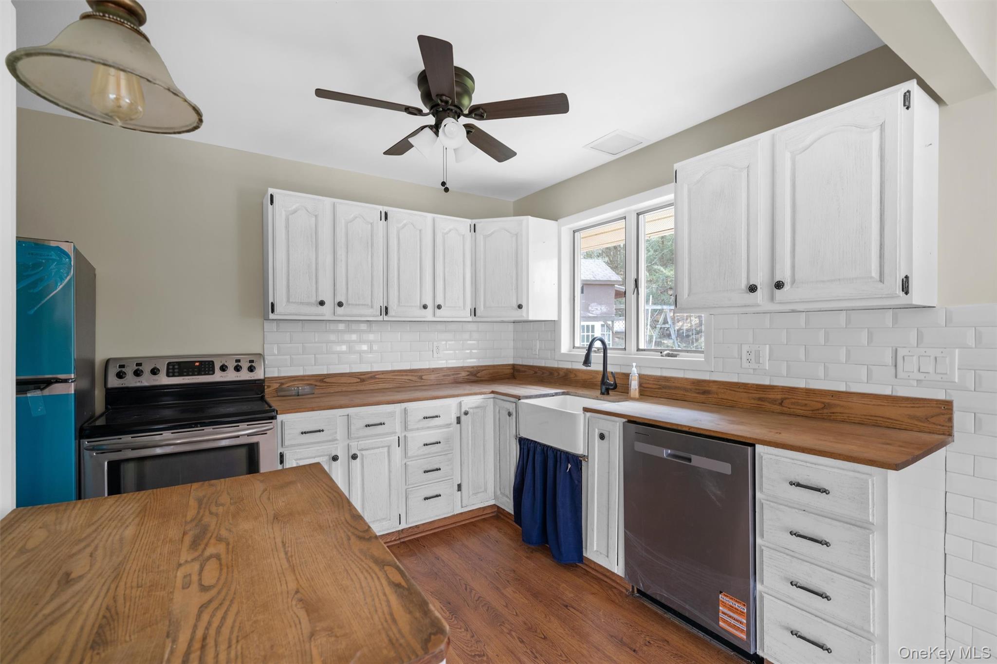 242 Callicoon Center Road Jeffersonville, NY 12748 - Photo 8 of 44 a kitchen with a cabinets appliances and a window