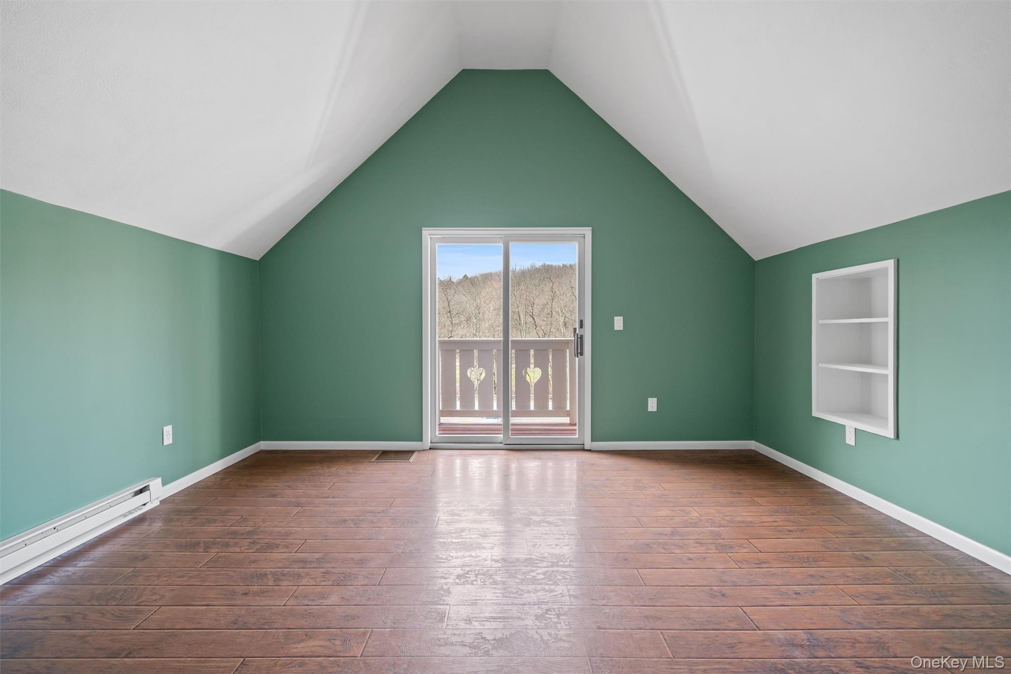 242 Callicoon Center Road Jeffersonville, NY 12748 - Photo 9 of 44 a view of an empty room with wooden floor and a window