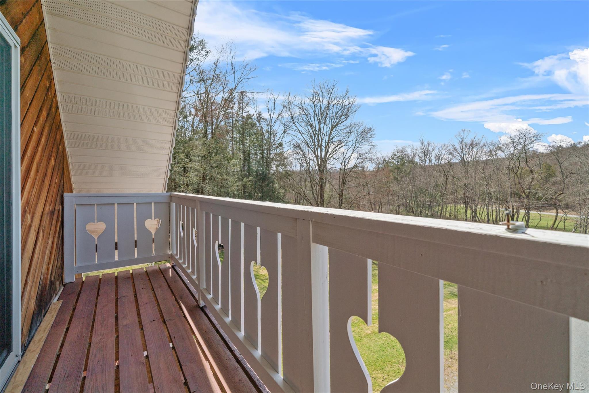 242 Callicoon Center Road Jeffersonville, NY 12748 - Photo 10 of 44 a balcony with wooden floor and fence