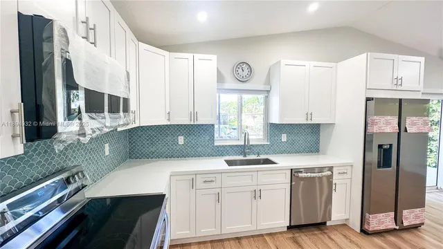 a view of a kitchen from the hallway