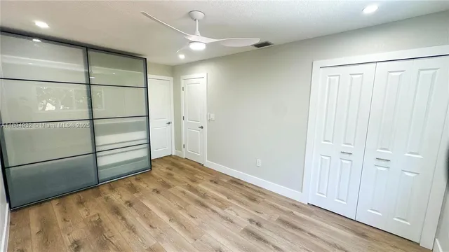 a view of a small space with wooden floor