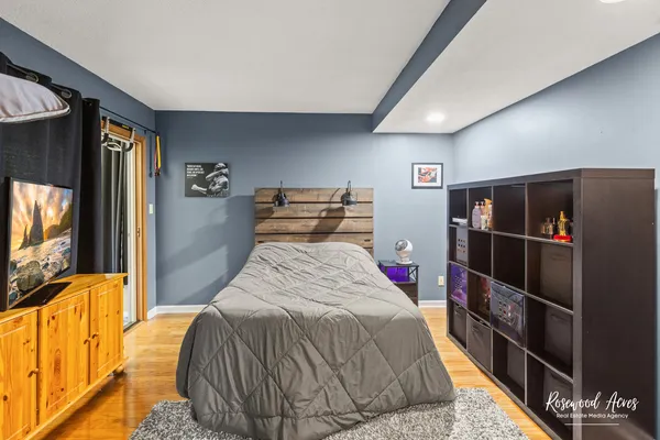 a bed room with a bed and a television