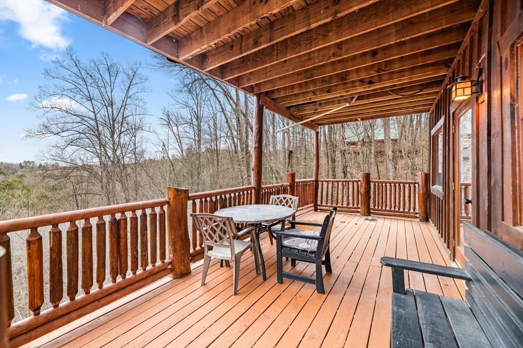 4130 Evans Chapel Road Sevierville, TN 37876 - Photo 25 of 33 a view of balcony with wooden floor and outdoor seating