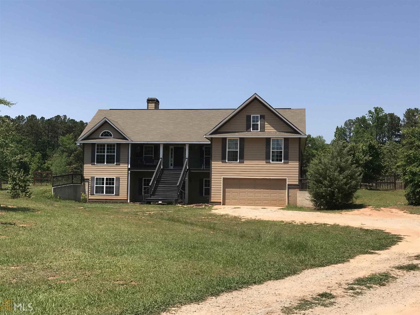 165 Butler Road Brooks, GA 30205 - Photo 1 of 1 a front view of a house with a yard
