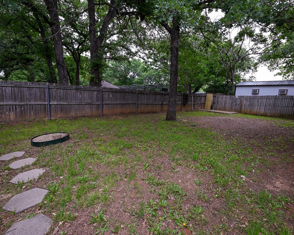 3201 South Garland Street Decatur, TX 76234 - Photo 16 of 20 a view of a backyard with a swing