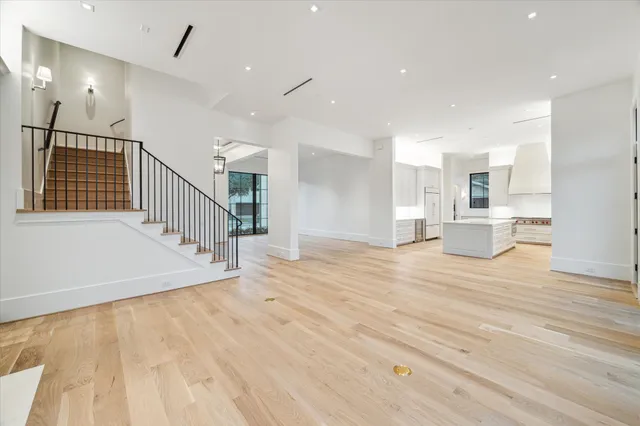 a view of a living room and wooden floor