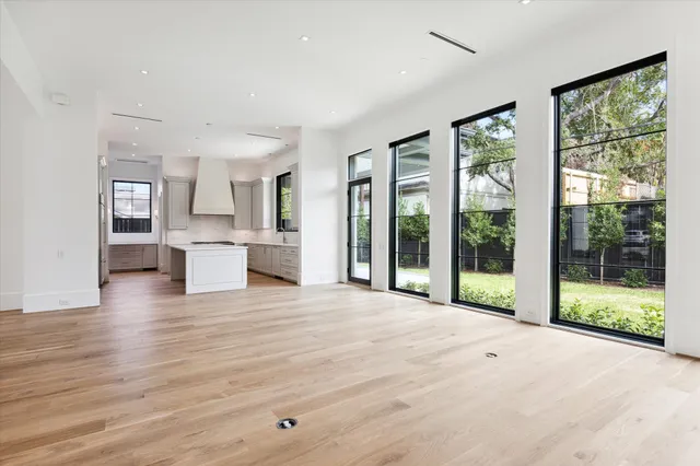 a view of kitchen with furniture and wooden floor