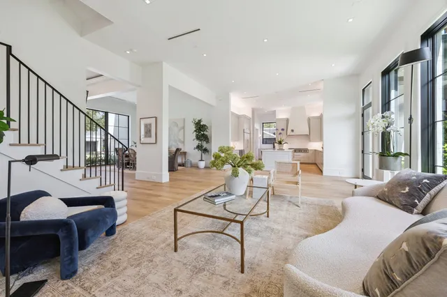 a living room with furniture or couch and a large window