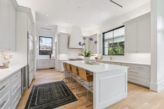 a bathroom with a sink a mirror and a bathtub