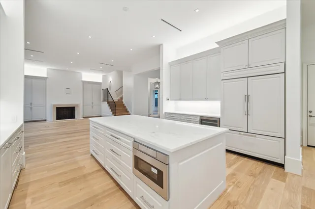 a large white bed in a white room