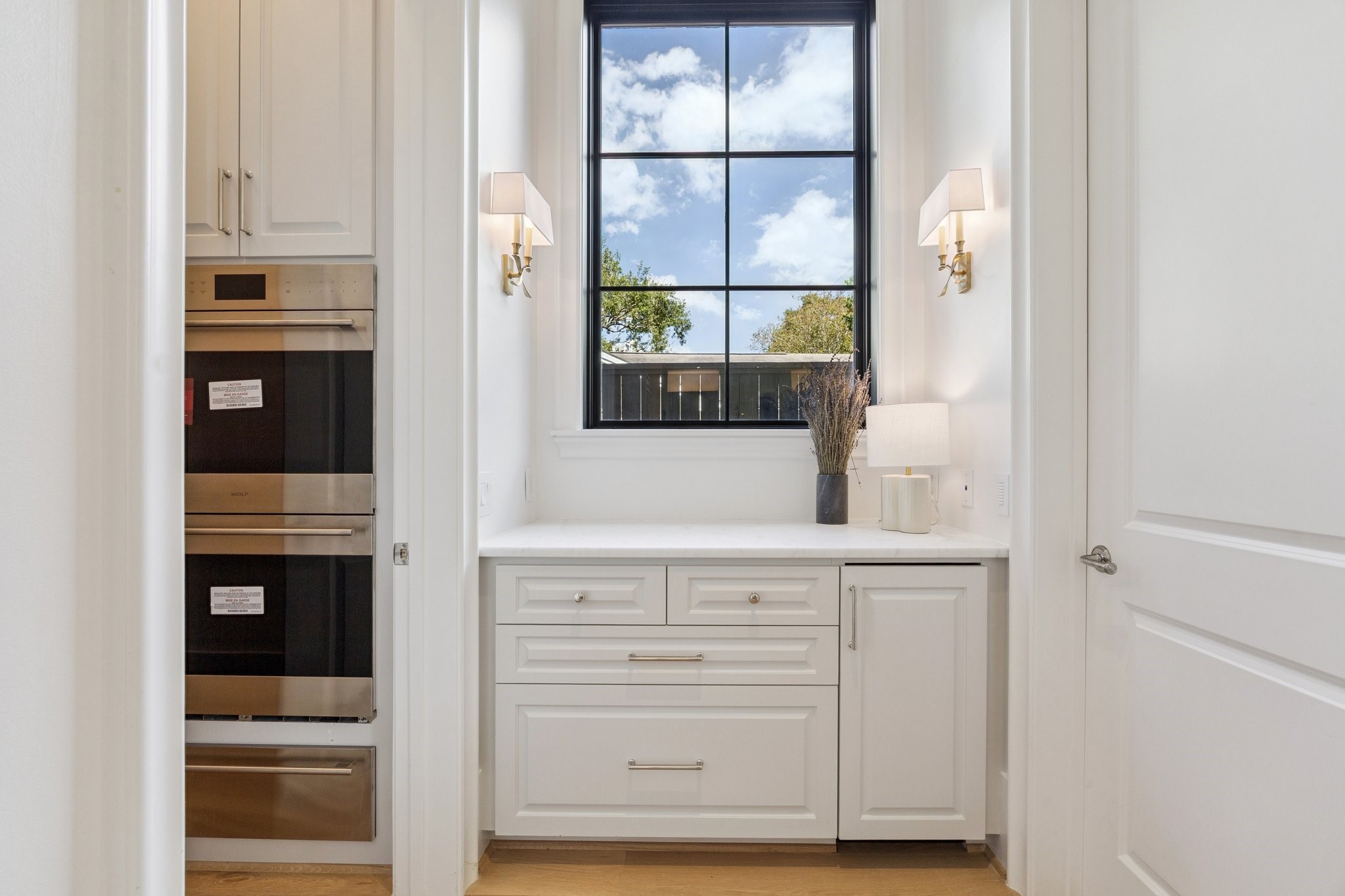 2711 Eastgrove Lane Houston, TX 77027 - Photo 22 of 48 a view of cabinets and window with wooden floor