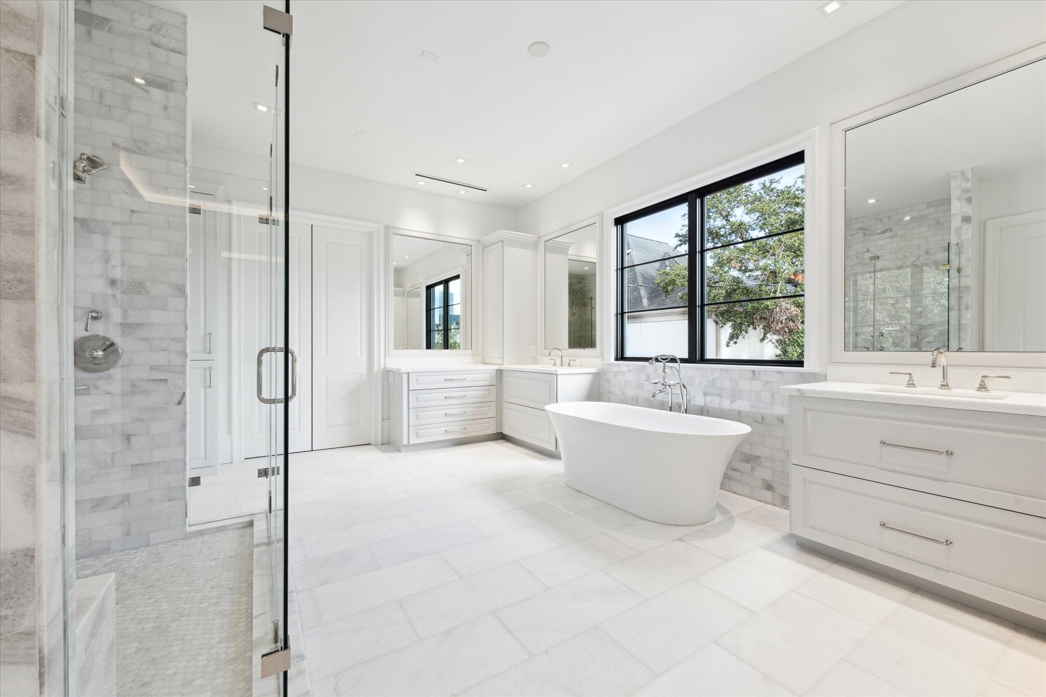 2711 Eastgrove Lane Houston, TX 77027 - Photo 27 of 48 a bathroom with a tub sink toilet and mirror