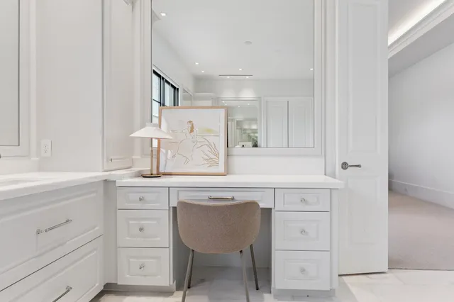 a kitchen with cabinets appliances and a window