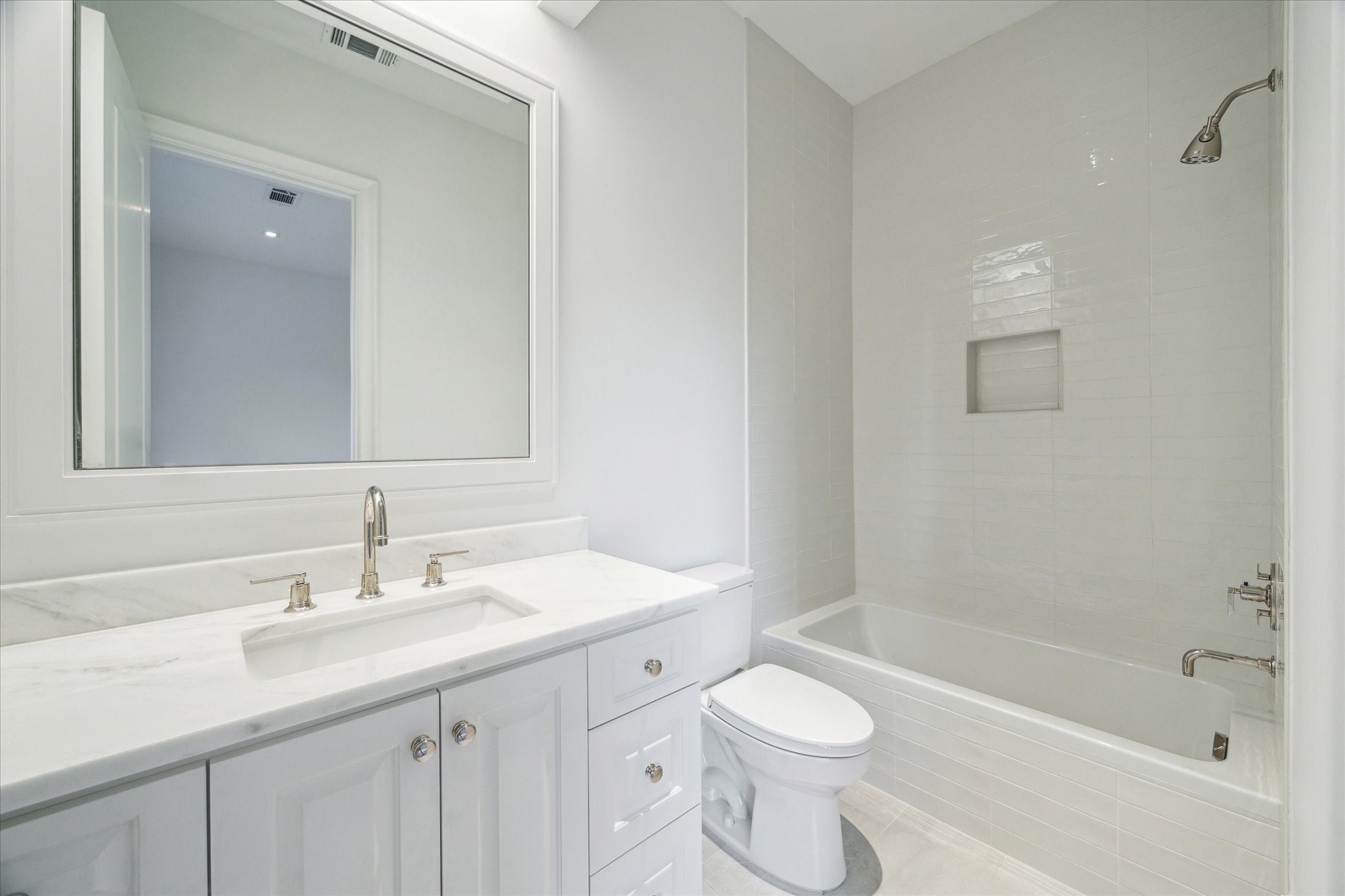 2711 Eastgrove Lane Houston, TX 77027 - Photo 35 of 48 a bathroom with a sink a toilet tub and shower