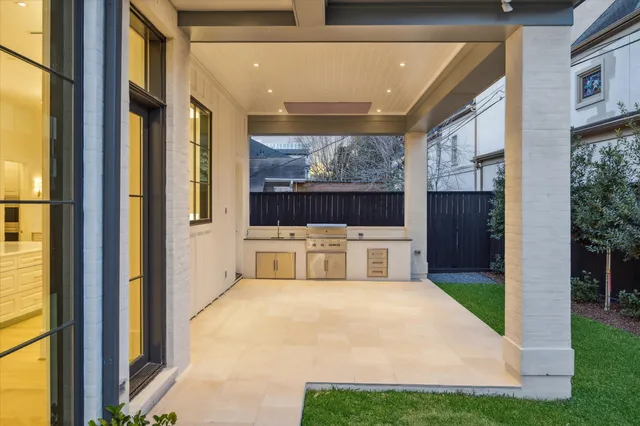 a view of a house with a porch and furniture