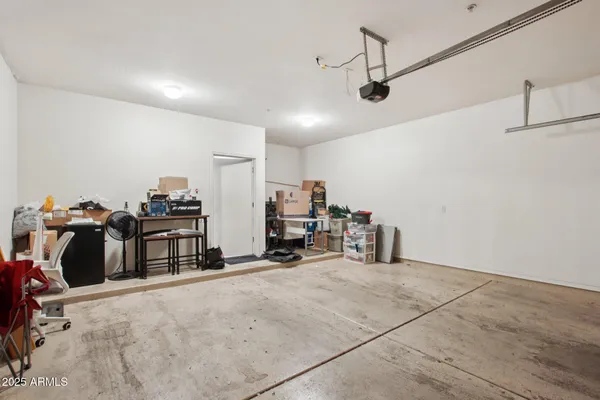 a view of a workspace with furniture and wooden floor
