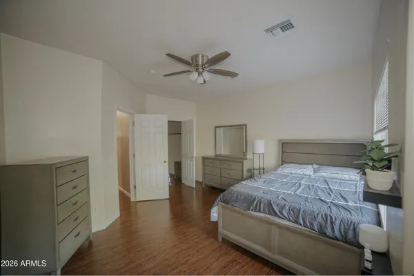 a kitchen with stainless steel appliances a sink stove refrigerator and cabinets