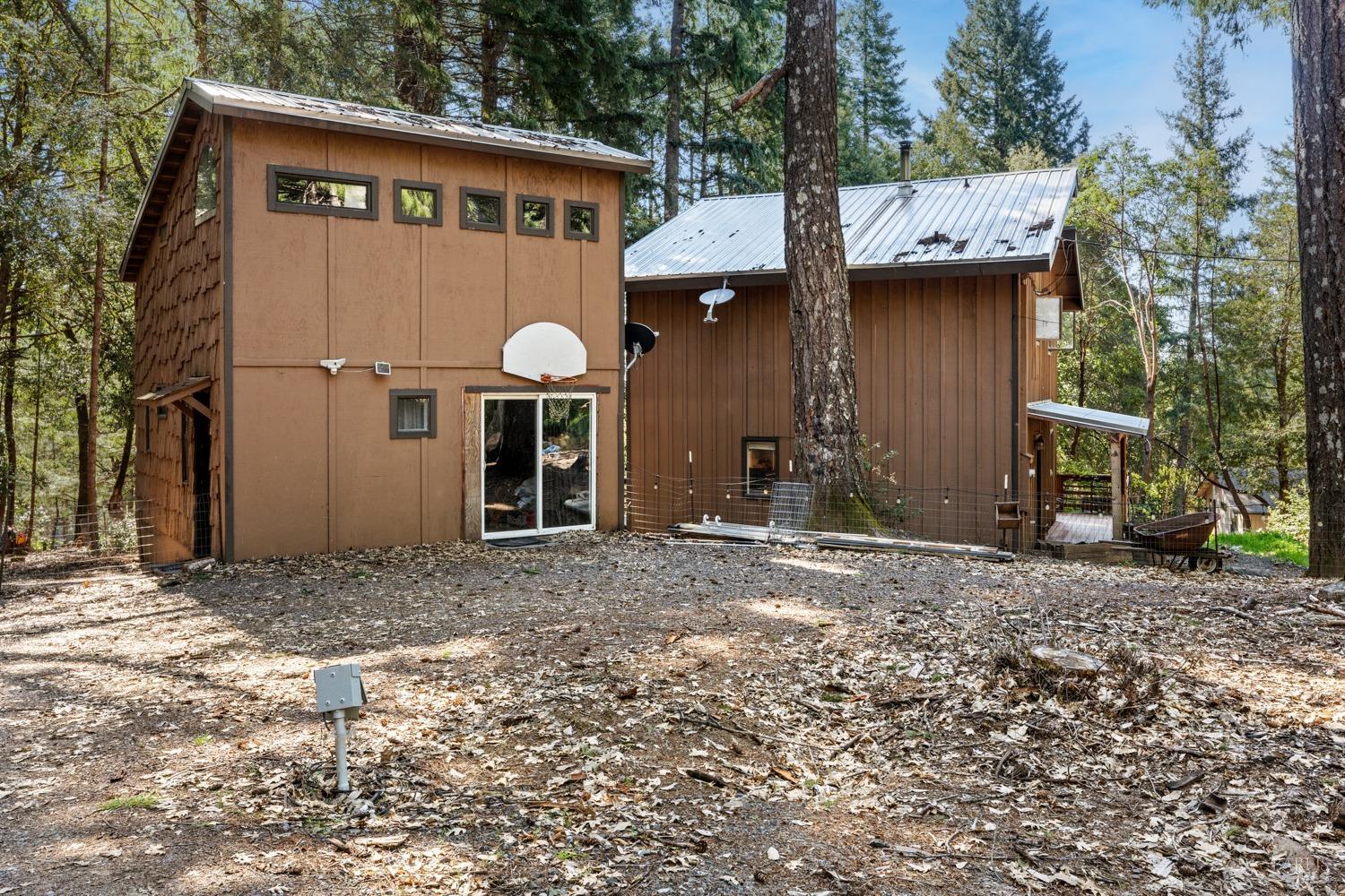 23551 Ridge Road Willits, CA 95490 - Photo 1 of 1 a view of a house with a yard and garage