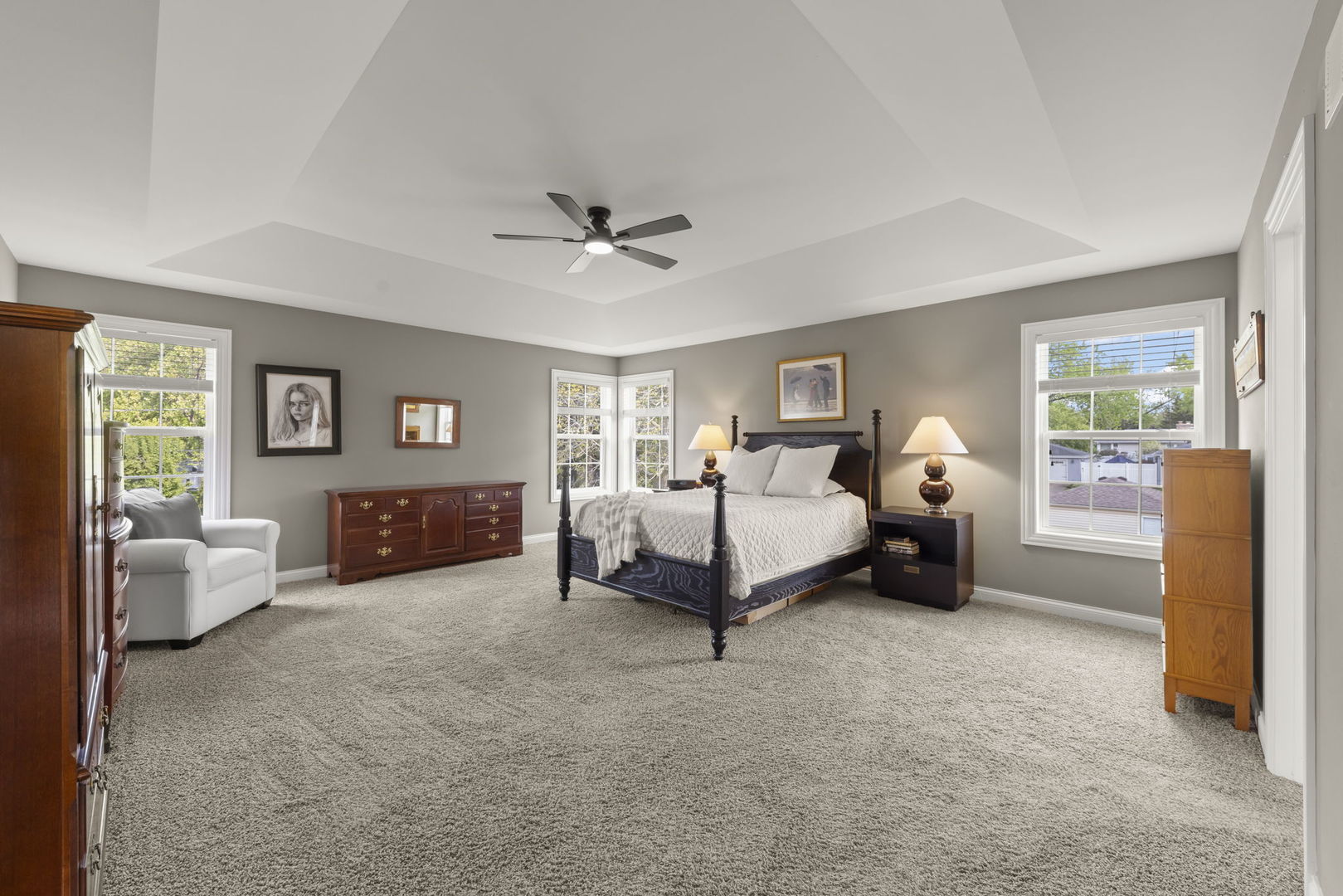 1711 Driving Park Road Wheaton, IL 60187 - Photo 14 of 41 a spacious bedroom with a bed and a couch