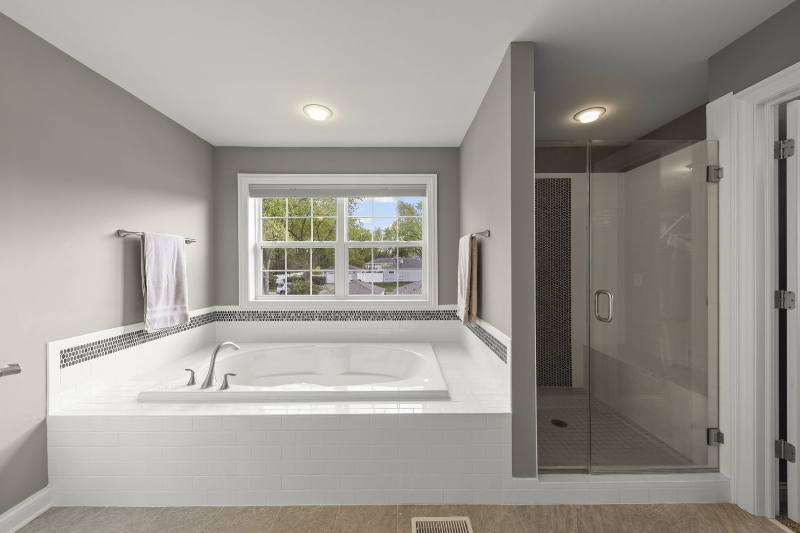 1711 Driving Park Road Wheaton, IL 60187 - Photo 17 of 41 a white bath tub sitting next to a window
