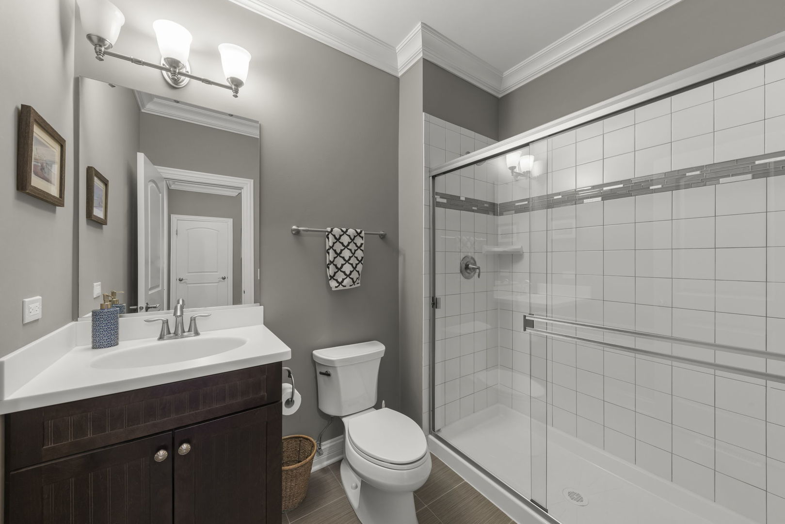 1711 Driving Park Road Wheaton, IL 60187 - Photo 21 of 41 a bathroom with a sink a toilet and shower