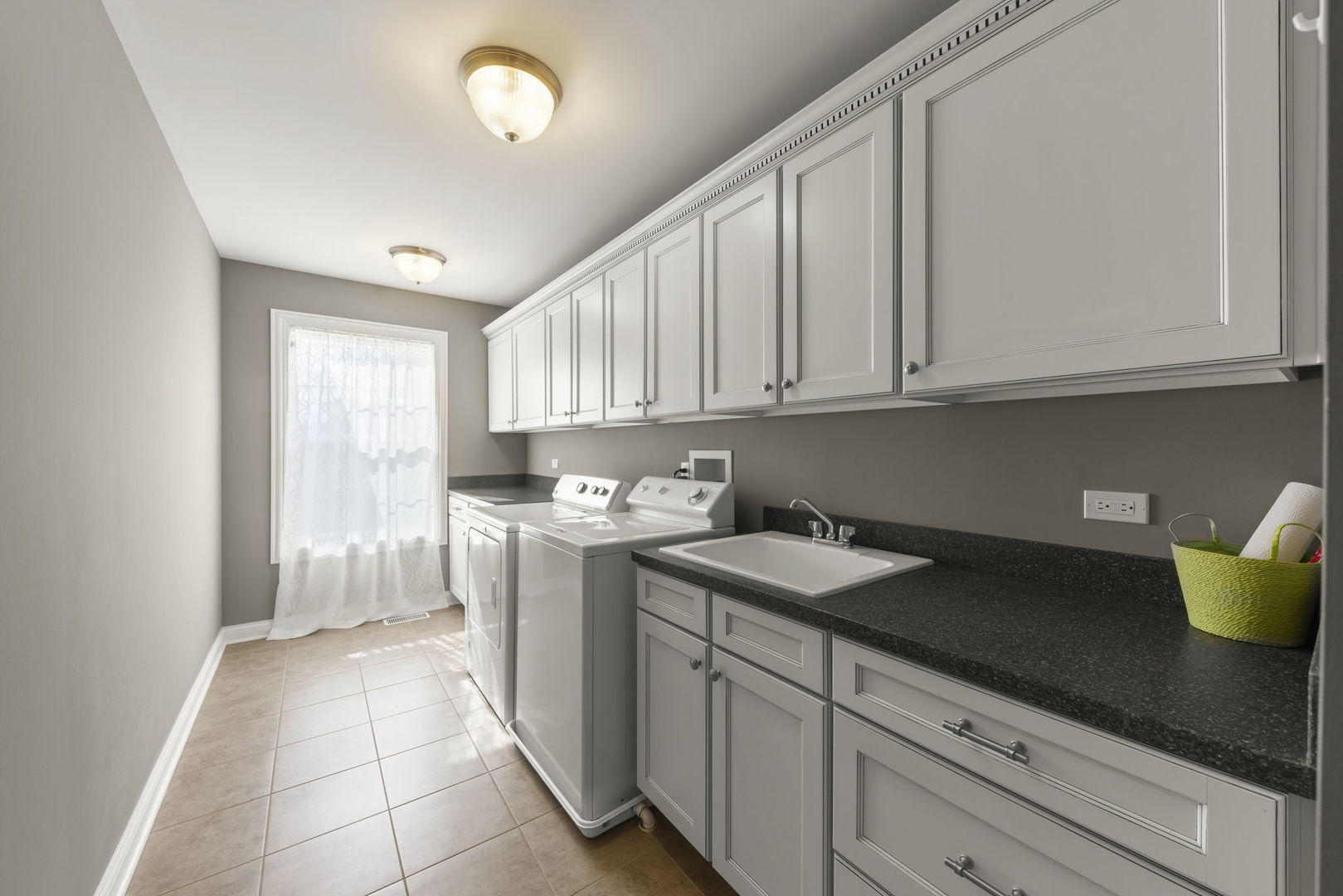 1711 Driving Park Road Wheaton, IL 60187 - Photo 26 of 41 a kitchen with a sink dishwasher and cabinets