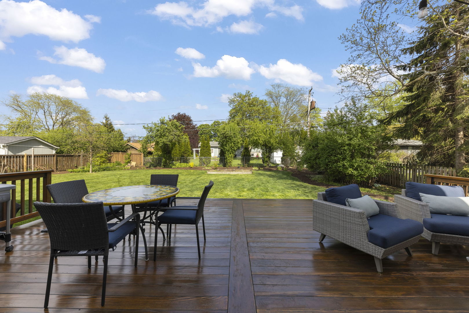 1711 Driving Park Road Wheaton, IL 60187 - Photo 28 of 41 a view of a patio with table and chairs and a barbeque