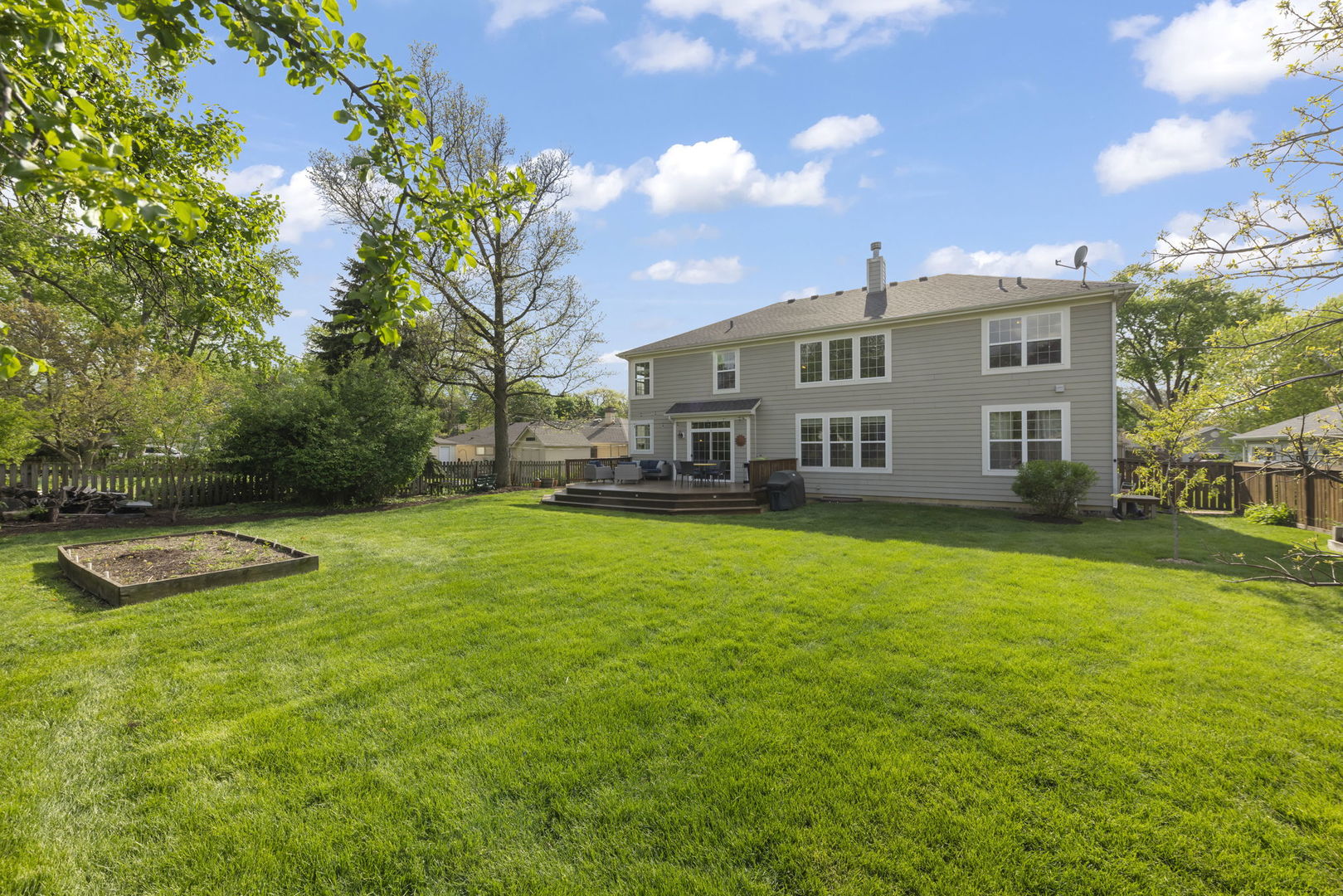 1711 Driving Park Road Wheaton, IL 60187 - Photo 30 of 41 a view of a house with a backyard