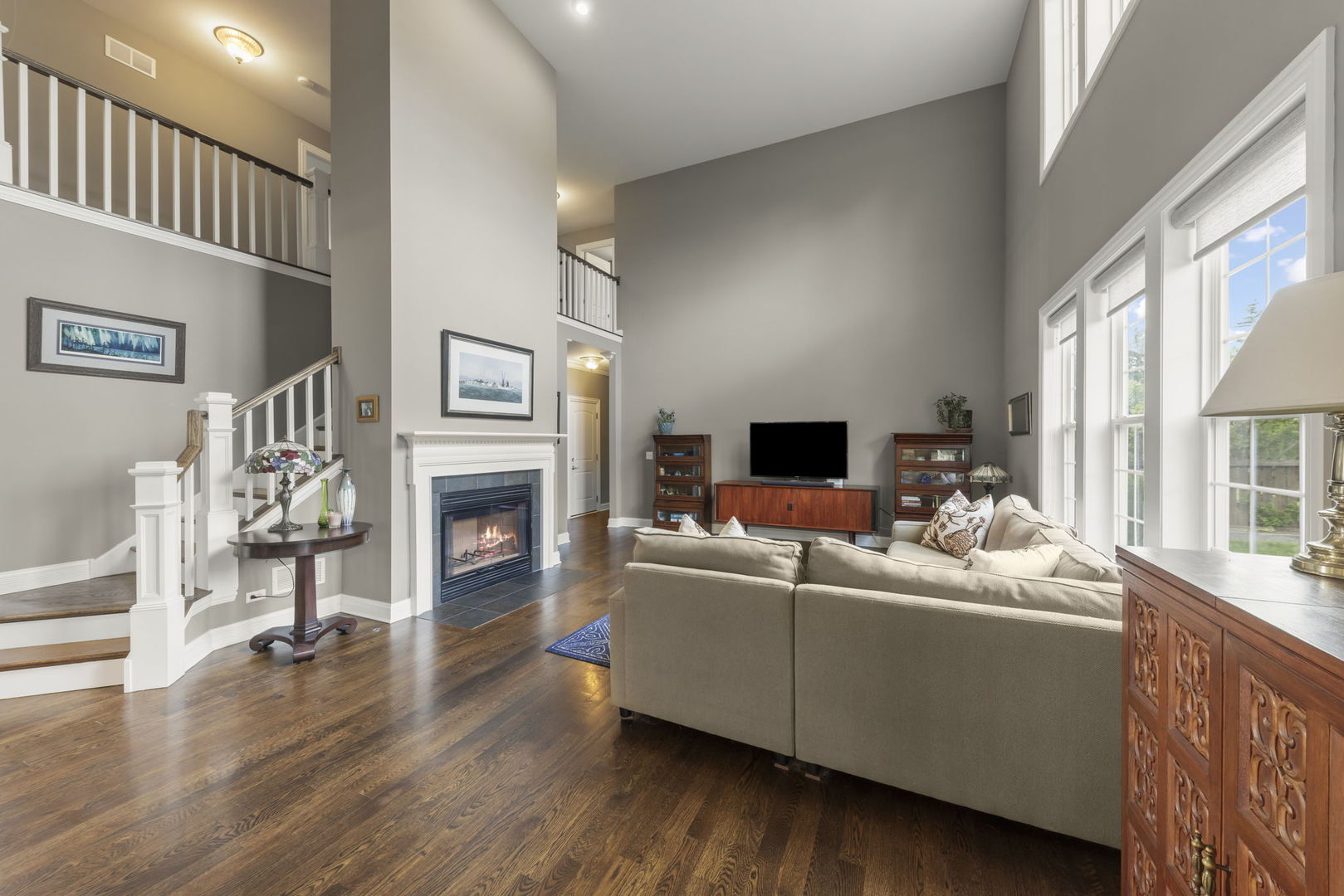 1711 Driving Park Road Wheaton, IL 60187 - Photo 10 of 41 a living room with furniture a fireplace and a flat screen tv