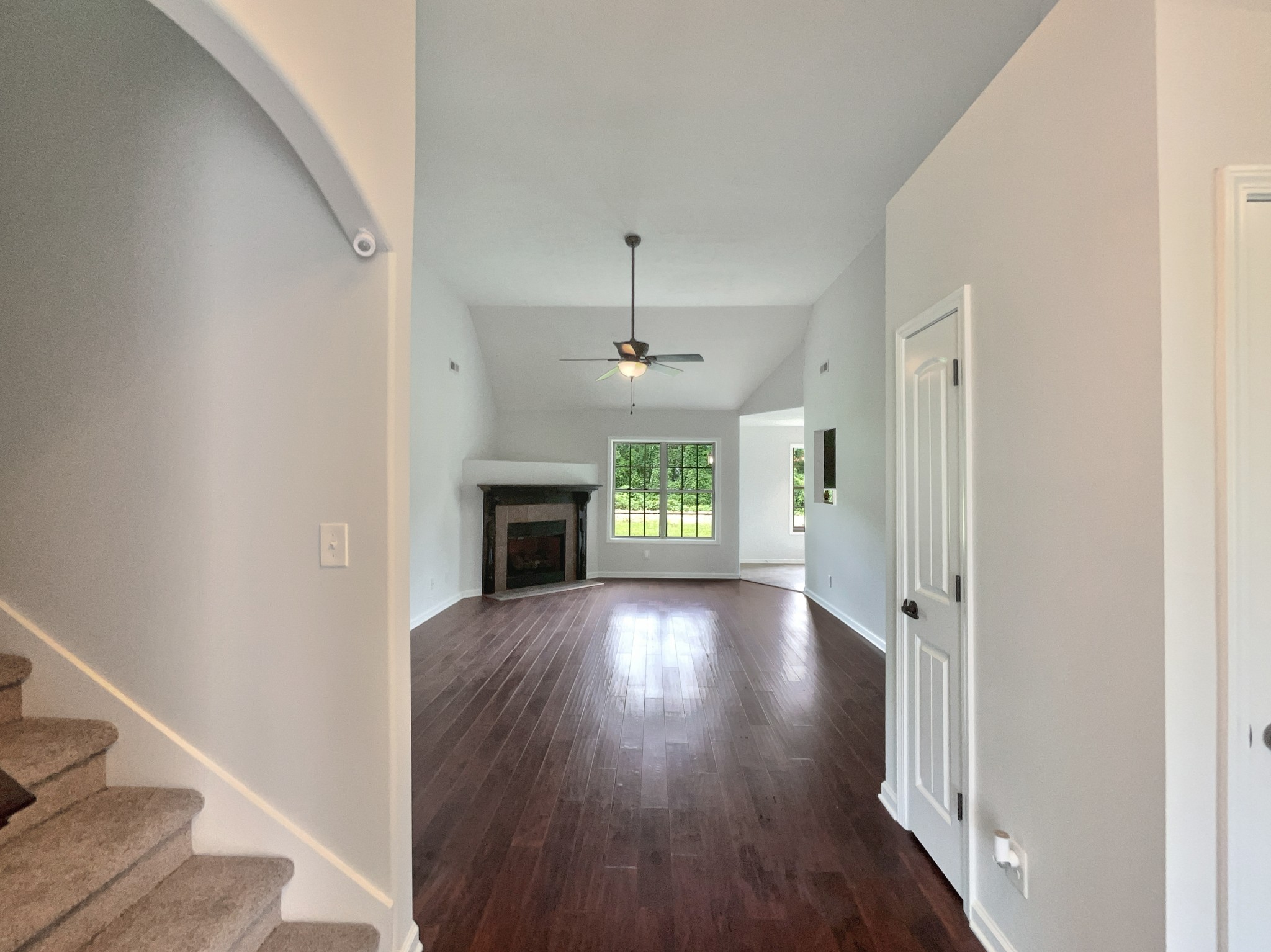 851 Salem Road Clarksville, TN 37040 - Photo 11 of 21 a view of an empty room with wooden floor fireplace and a window