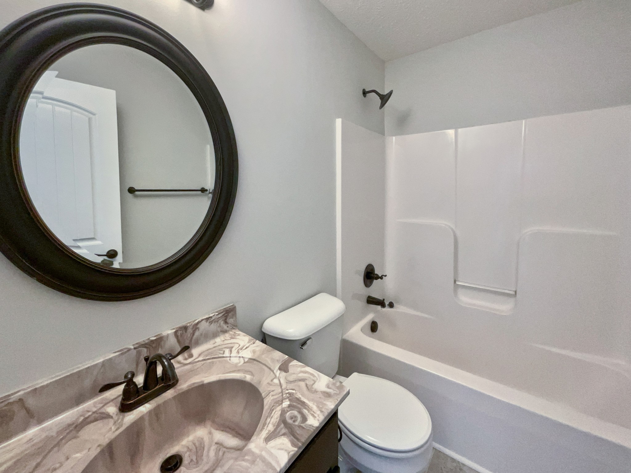 851 Salem Road Clarksville, TN 37040 - Photo 12 of 21 a bathroom with a sink a toilet and a mirror