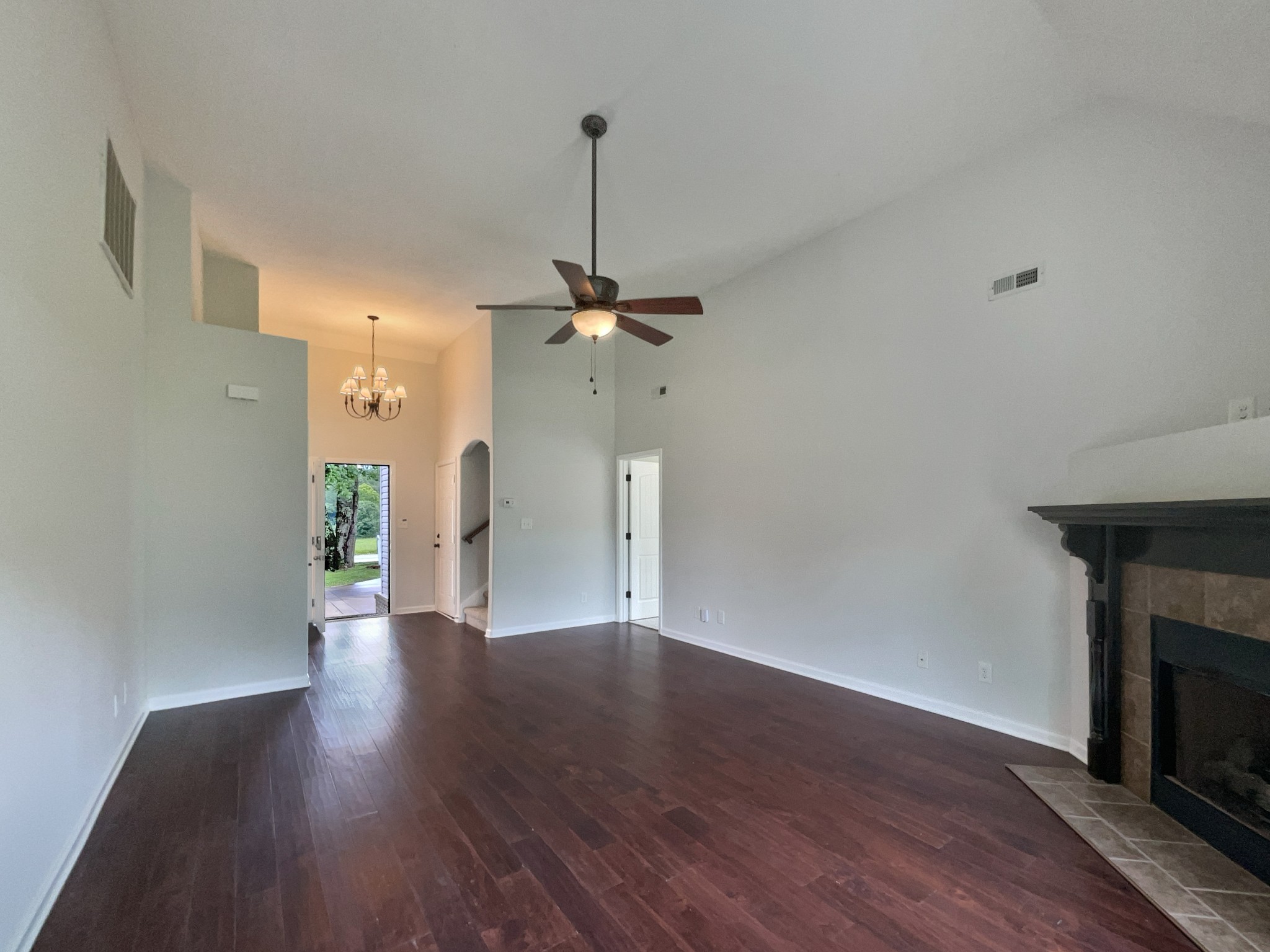 851 Salem Road Clarksville, TN 37040 - Photo 14 of 21 a view of an empty room with wooden floor a fireplace and a window