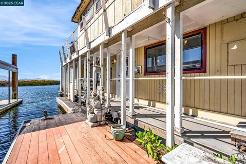 a view of a chairs and table in the patio