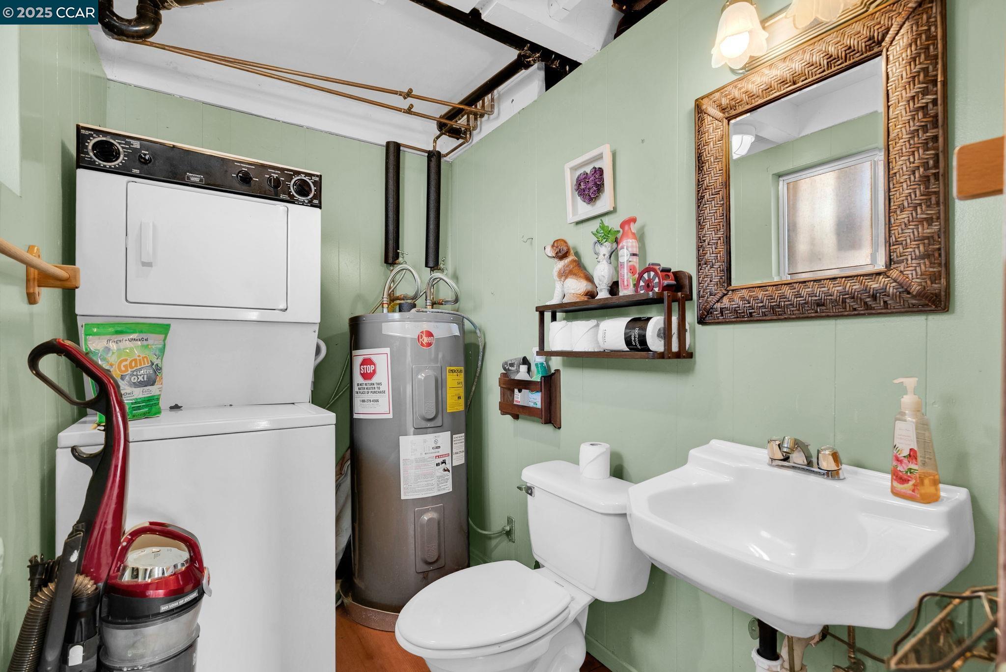 1818 Taylor Road Bethel Island, CA 94511 - Photo 15 of 59 a bathroom with a sink a toilet and a mirror