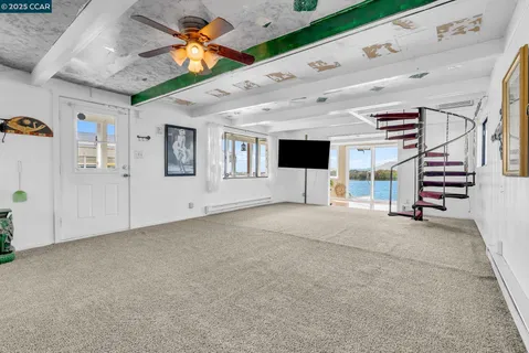 a view of living room with furniture and flat screen tv